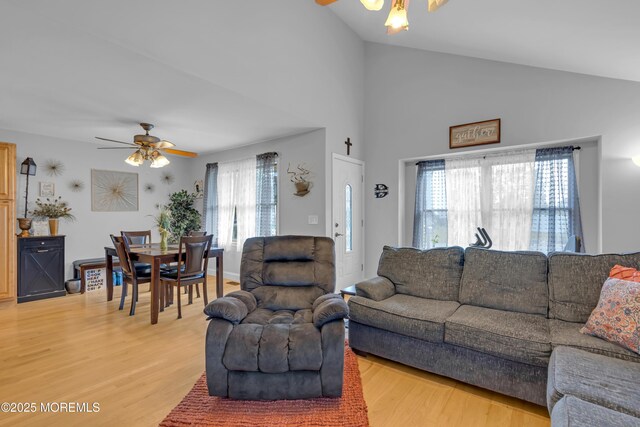 1506 Beverly Rd, Forked River, NJ 08731 - living area featuring ceiling fan, plenty of natural light, light wood-type flooring, and vaulted ceiling