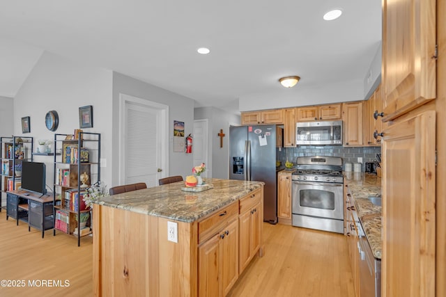 1506 Beverly Rd, Forked River, NJ 08731 - kitchen with appliances with stainless steel finishes, light wood-style floors, light stone countertops, tasteful backsplash, and recessed lighting