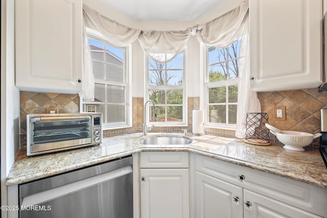 96 Kentucky Way, Freehold, NJ 07728 - kitchen with stainless steel dishwasher, tasteful backsplash, white cabinetry, and light stone countertops