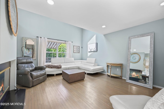 96 Kentucky Way, Freehold, NJ 07728 - living area with a glass covered fireplace, hardwood / wood-style floors, and recessed lighting