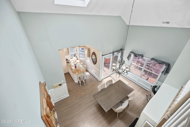 96 Kentucky Way, Freehold, NJ 07728 - living area featuring a skylight, high vaulted ceiling, and wood finished floors