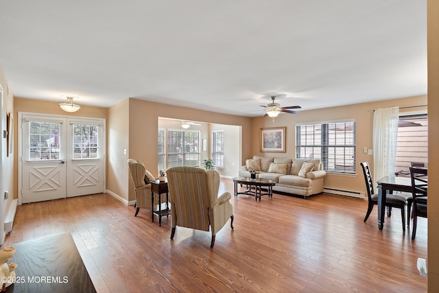 603-B Bosworth Ct, Manchester, NJ 08759 - living room featuring a ceiling fan, wood finished floors, a baseboard radiator, and french doors