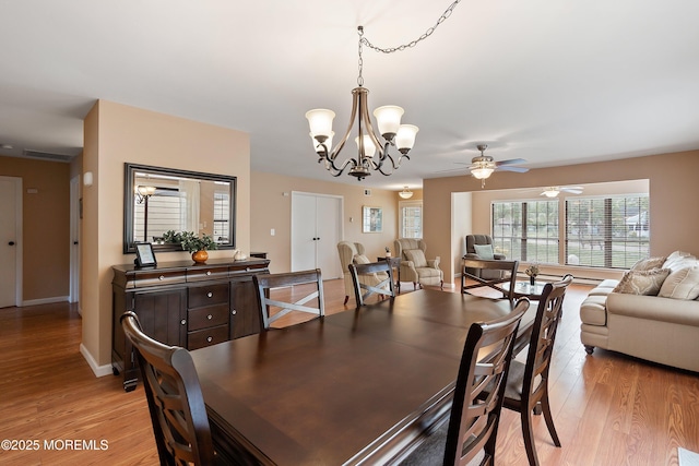 603-B Bosworth Ct, Manchester, NJ 08759 - dining room featuring light wood finished floors, a chandelier, and a ceiling fan