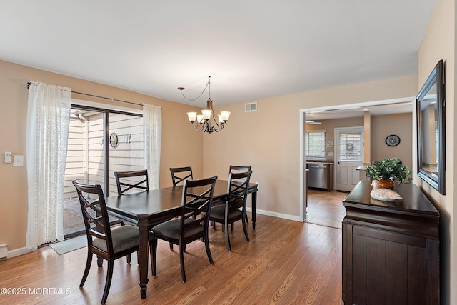 603-B Bosworth Ct, Manchester, NJ 08759 - dining area featuring light wood-style flooring and a chandelier