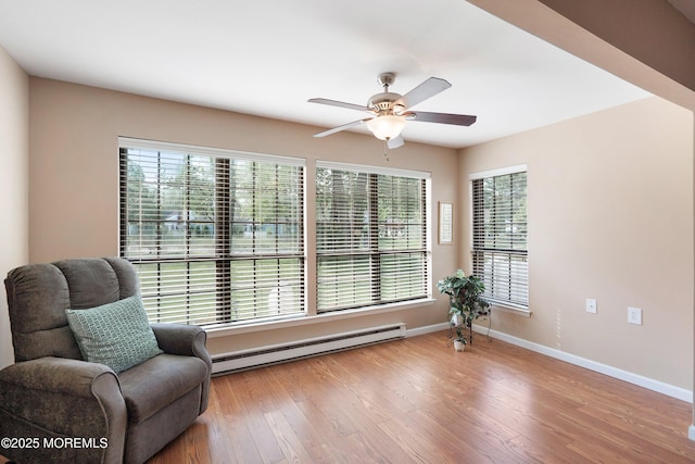 603-B Bosworth Ct, Manchester, NJ 08759 - sitting room with baseboard heating, ceiling fan, and wood finished floors