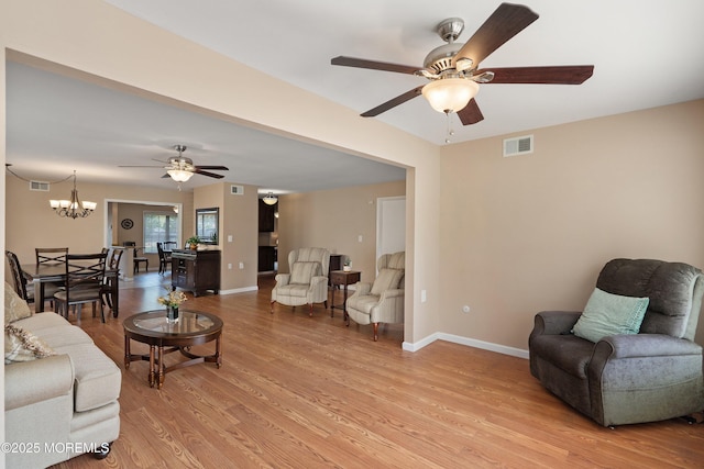 603-B Bosworth Ct, Manchester, NJ 08759 - living area featuring a ceiling fan, light wood-style floors, and a chandelier