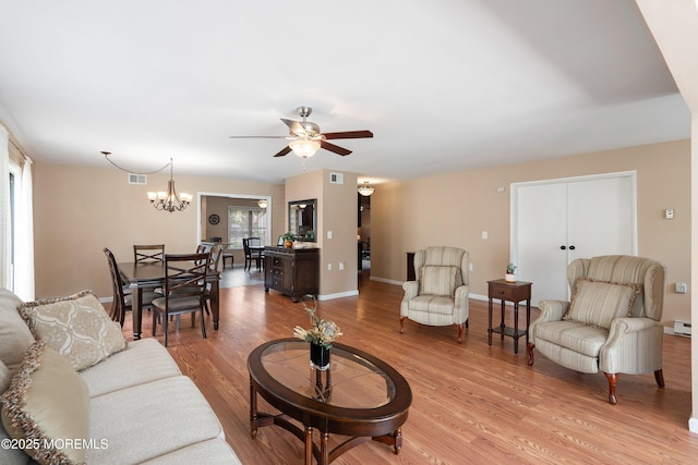 603-B Bosworth Ct, Manchester, NJ 08759 - living area featuring ceiling fan, light wood-type flooring, a chandelier, and a baseboard radiator