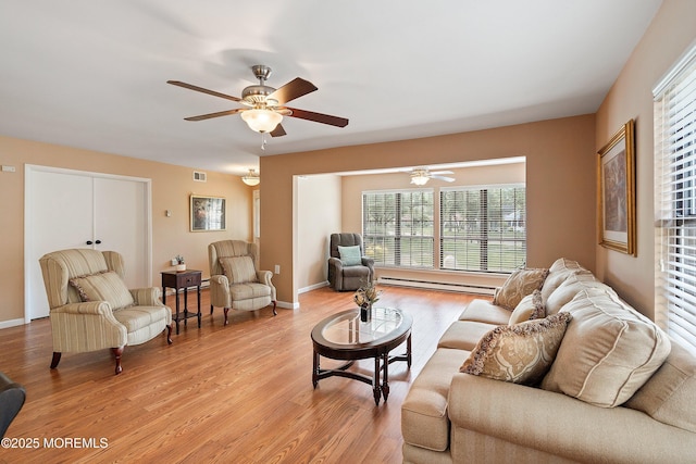 603-B Bosworth Ct, Manchester, NJ 08759 - living area featuring a ceiling fan, healthy amount of natural light, light wood-style flooring, and baseboard heating