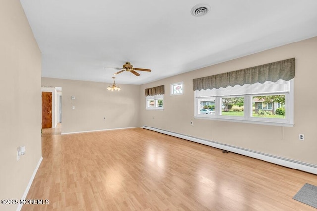 68 Barbados Dr S, Toms River, NJ 08757 - spare room featuring baseboard heating, a ceiling fan, light wood-style floors, and a chandelier