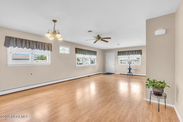 68 Barbados Dr S, Toms River, NJ 08757 - empty room with baseboard heating, light wood-style floors, a ceiling fan, and a chandelier