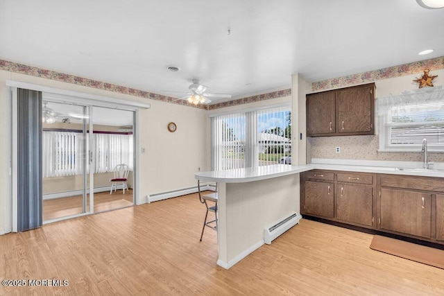 68 Barbados Dr S, Toms River, NJ 08757 - kitchen featuring a baseboard radiator, a kitchen breakfast bar, and light countertops