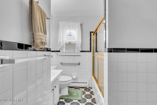 68 Barbados Dr S, Toms River, NJ 08757 - full bathroom featuring tile walls, baseboard heating, vanity, tile patterned floors, and wainscoting
