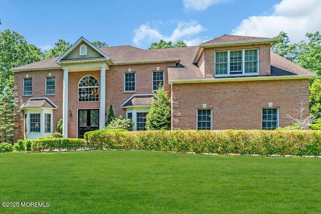 312 Clearstream Rd, Jackson, NJ 08527 - greek revival inspired property featuring a front lawn and brick siding