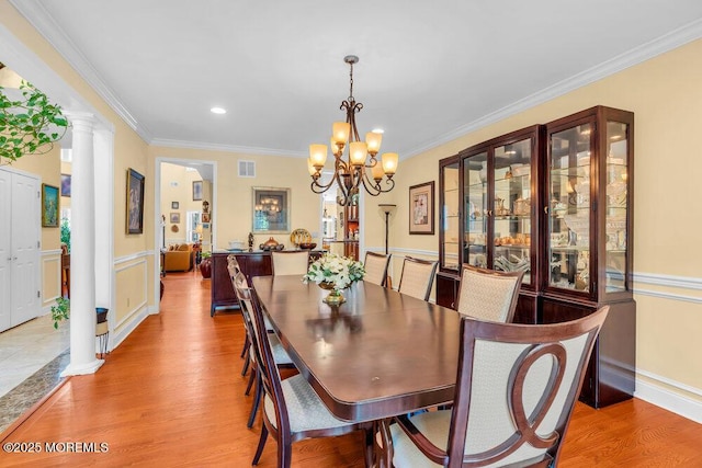 312 Clearstream Rd, Jackson, NJ 08527 - dining area featuring light wood-type flooring, ornamental molding, a chandelier, decorative columns, and recessed lighting