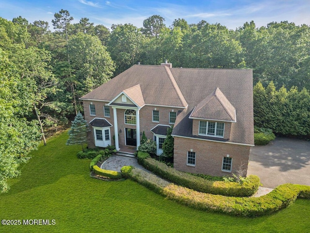 312 Clearstream Rd, Jackson, NJ 08527 - greek revival inspired property with a front yard and a chimney