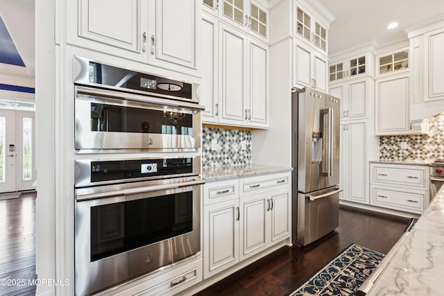 23 Interlachen Ct, Monroe, NJ 08831 - kitchen featuring high end appliances, backsplash, dark wood-style floors, white cabinetry, and light stone countertops