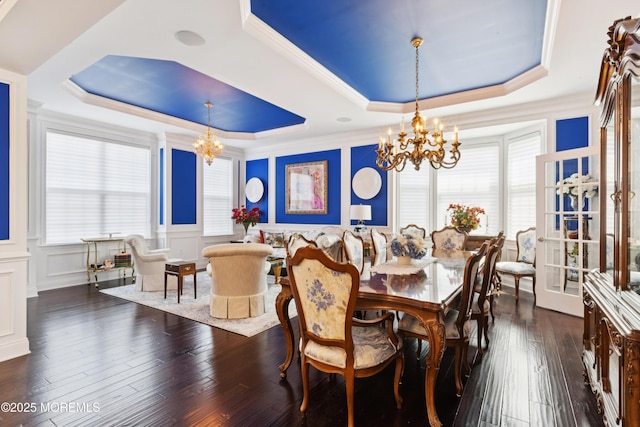 23 Interlachen Ct, Monroe, NJ 08831 - dining room featuring a chandelier, a raised ceiling, plenty of natural light, a decorative wall, and wainscoting