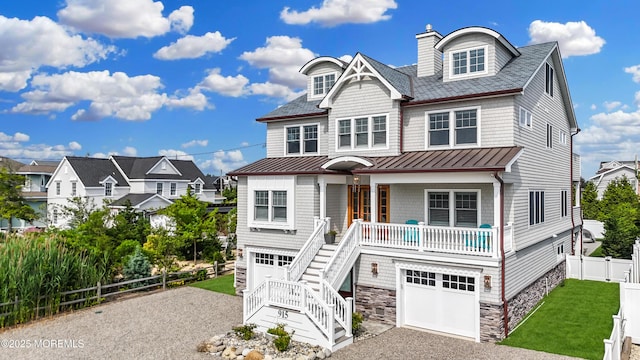 915 Barnegat Ln, Mantoloking, NJ 08738 - view of front of home with a standing seam roof, asphalt driveway, a porch, an attached garage, and stairway