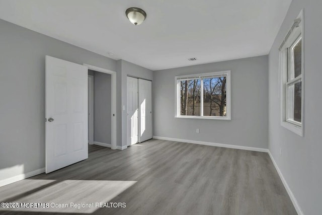58 Chadwick Ave, Toms River, NJ 08753 - unfurnished bedroom with wood finished floors and a closet