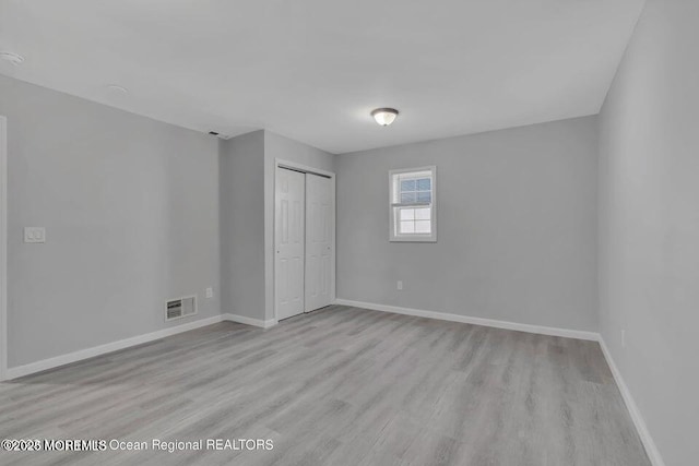 58 Chadwick Ave, Toms River, NJ 08753 - unfurnished bedroom featuring light wood-type flooring and a closet