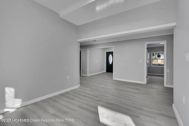 58 Chadwick Ave, Toms River, NJ 08753 - unfurnished living room featuring baseboards and wood finished floors