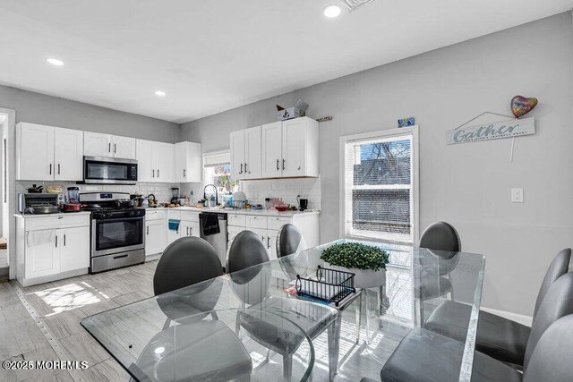 58 Chadwick Ave, Toms River, NJ 08753 - kitchen with appliances with stainless steel finishes, white cabinetry, backsplash, and recessed lighting