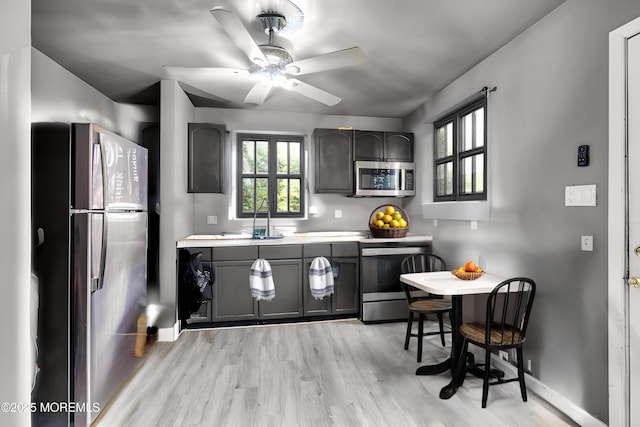 49 Poppy St, Browns Mills, NJ 08015 - kitchen with appliances with stainless steel finishes, light wood-style flooring, light countertops, and gray cabinets