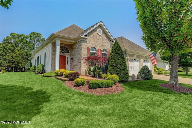 86 Wild Dunes Way, Jackson, NJ 08527 - view of front facade featuring an attached garage, a front yard, brick siding, and driveway