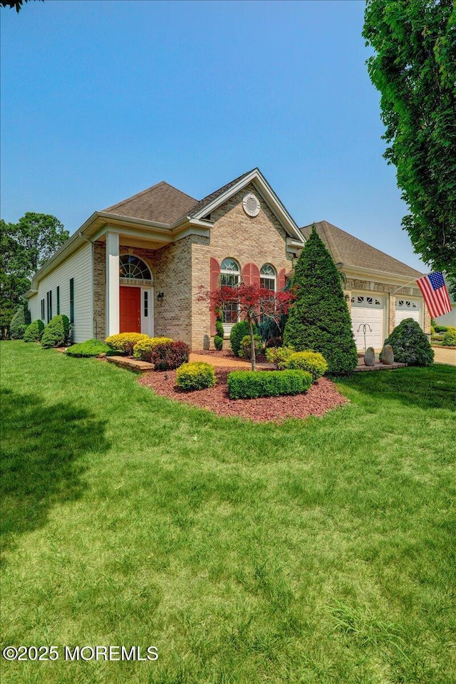86 Wild Dunes Way, Jackson, NJ 08527 - view of front of property featuring an attached garage, a front lawn, and brick siding