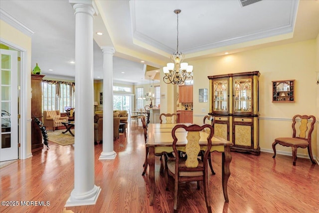 86 Wild Dunes Way, Jackson, NJ 08527 - dining room featuring ornate columns, crown molding, light wood-type flooring, a chandelier, and a tray ceiling