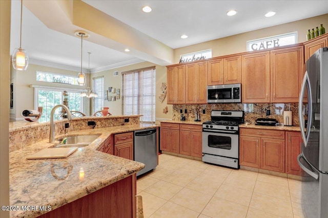 86 Wild Dunes Way, Jackson, NJ 08527 - kitchen featuring stainless steel appliances, decorative backsplash, light stone counters, ornamental molding, and hanging light fixtures