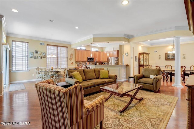 86 Wild Dunes Way, Jackson, NJ 08527 - living area with ornate columns, ornamental molding, a chandelier, recessed lighting, and light wood-style floors