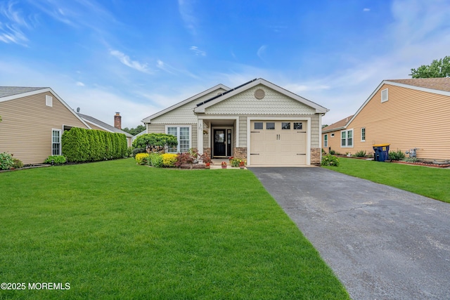 61 Mansfield Ave, Manchester, NJ 08759 - view of front facade featuring driveway, a garage, a front yard, and stone siding