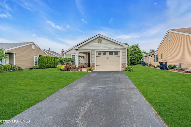 61 Mansfield Ave, Manchester, NJ 08759 - view of front of house featuring a front yard, an attached garage, stone siding, and asphalt driveway
