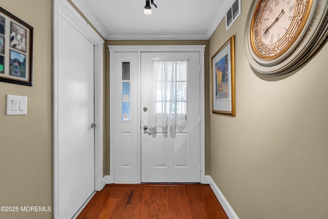 61 Mansfield Ave, Manchester, NJ 08759 - doorway to outside featuring dark wood-style floors and crown molding