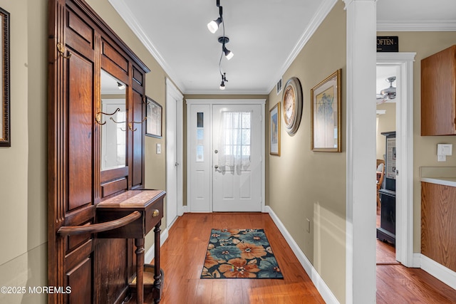 61 Mansfield Ave, Manchester, NJ 08759 - entryway featuring light wood-style floors, crown molding, and rail lighting