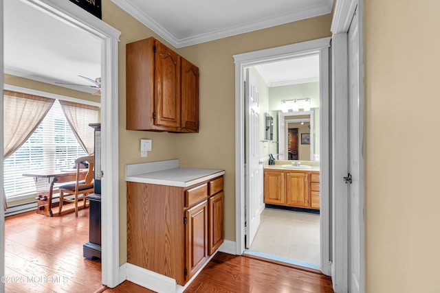 61 Mansfield Ave, Manchester, NJ 08759 - bar with ornamental molding, light wood-style floors, and a ceiling fan
