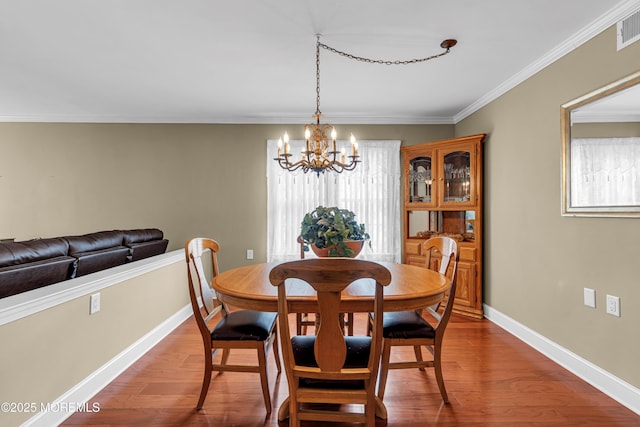 61 Mansfield Ave, Manchester, NJ 08759 - dining area with a chandelier, wood finished floors, and crown molding