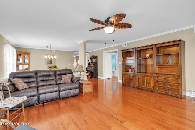 61 Mansfield Ave, Manchester, NJ 08759 - living room with ceiling fan, light wood-style flooring, crown molding, and a chandelier