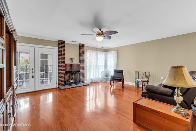 61 Mansfield Ave, Manchester, NJ 08759 - living area with healthy amount of natural light, wood finished floors, crown molding, ceiling fan, and a fireplace
