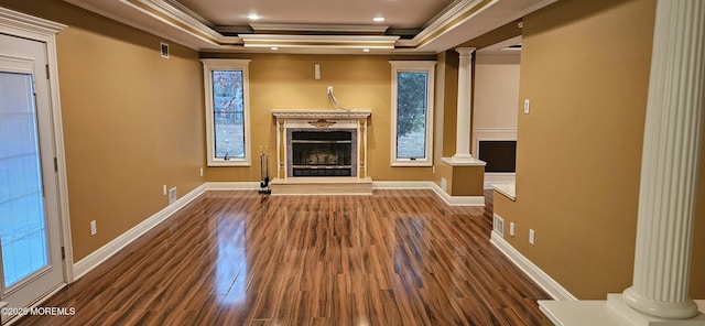 7 Quaker Hill Rd, Jackson, NJ 08527 - unfurnished living room featuring decorative columns, crown molding, wood finished floors, a fireplace with raised hearth, and a raised ceiling