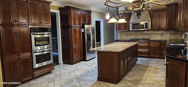 7 Quaker Hill Rd, Jackson, NJ 08527 - kitchen with stainless steel appliances, ornamental molding, a chandelier, tasteful backsplash, and stone tile flooring