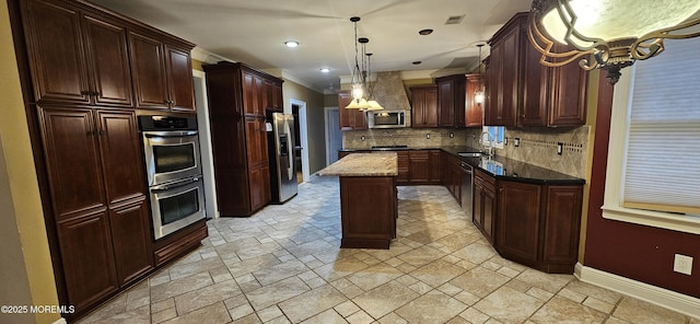 7 Quaker Hill Rd, Jackson, NJ 08527 - kitchen with appliances with stainless steel finishes, stone tile flooring, a center island, decorative backsplash, and pendant lighting