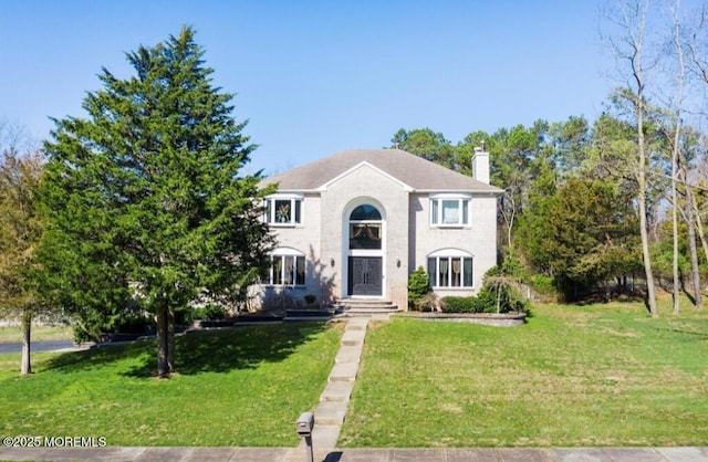 7 Quaker Hill Rd, Jackson, NJ 08527 - view of front of house with a chimney and a front yard