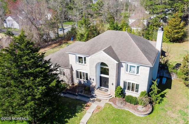7 Quaker Hill Rd, Jackson, NJ 08527 - view of front of property featuring a chimney, a shingled roof, and a front yard
