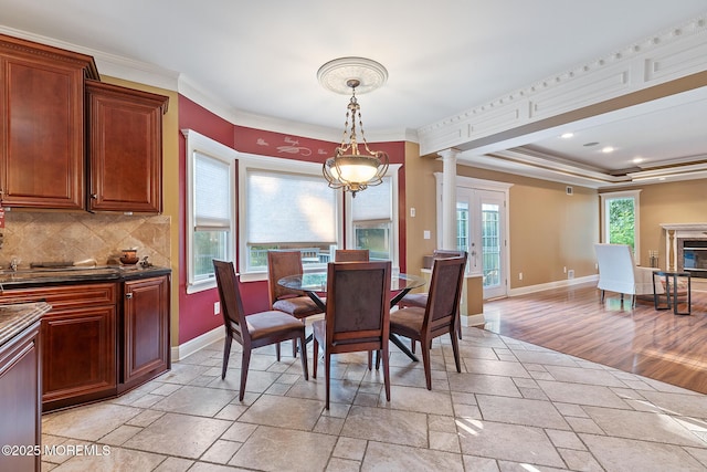 7 Quaker Hill Rd, Jackson, NJ 08527 - dining space with stone tile flooring, crown molding, and ornate columns
