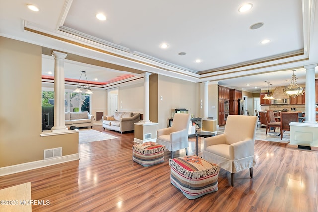 7 Quaker Hill Rd, Jackson, NJ 08527 - living area with ornate columns, a tray ceiling, ornamental molding, wood finished floors, and recessed lighting
