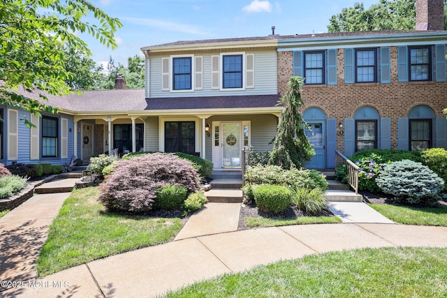 11 Interlaken Ct Unit 9, Freehold, NJ 07728 - view of front of property featuring a chimney and covered porch