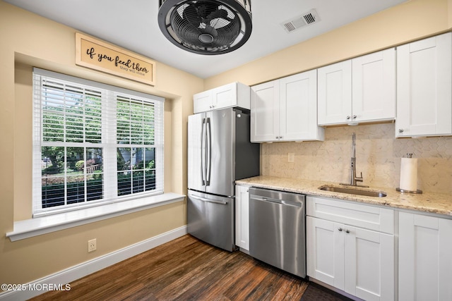 11 Interlaken Ct Unit 9, Freehold, NJ 07728 - kitchen with appliances with stainless steel finishes, dark wood-type flooring, backsplash, white cabinets, and light stone counters