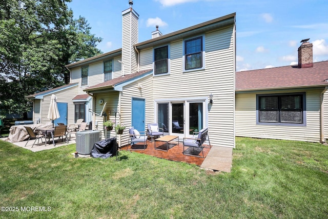 11 Interlaken Ct Unit 9, Freehold, NJ 07728 - back of property featuring a patio area, a chimney, and a yard